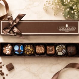 Box of assorted chocolates with a ribbon bow
