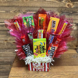 Candy bouquet in a striped box with red cellophane wrapping