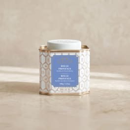 Decorative tin of loose leaf tea with a white lid