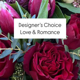 Bouquet of red and pink roses with tulips and purple blooms