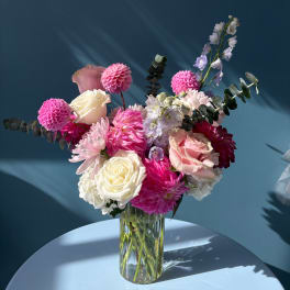 Pink and white mixed bouquet in a clear glass vase