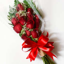 Bouquet of red roses with baby's breath and a red ribbon
