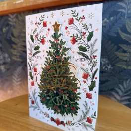 Christmas card with a decorated tree and floral border