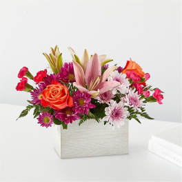 Mixed bouquet in a white rectangular box with lilies, roses, and daisies