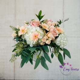Bouquet of pale pink roses, white hydrangeas, and peach gerbera daisies