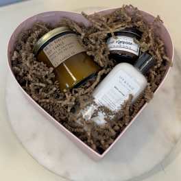 Heart-shaped gift box with candles, body lotion, and sugar scrub