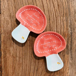 Two mushroom-shaped ceramic dishes with coral and white glaze