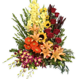 Tall mixed bouquet with red roses, lilies, and sunflowers