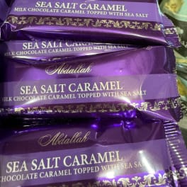 Stack of purple sea salt caramel chocolate candy bars