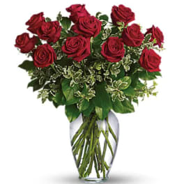 Bouquet of red roses in a clear glass vase