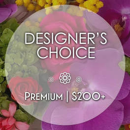 Designer’s choice floral arrangement with pink and purple blooms