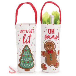 Two holiday wine bottle gift bags with festive Christmas designs