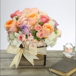 Pastel rose bouquet in a square box with a ribbon