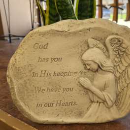 Memorial stone with an angel and engraved sympathy message