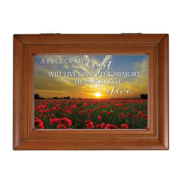 Wooden framed memorial plaque with a poppy field and sunset quote