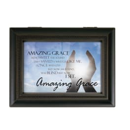 Framed wall art with the words Amazing Grace and raised hands