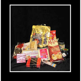 Assorted snack and candy gift items arranged on a black background