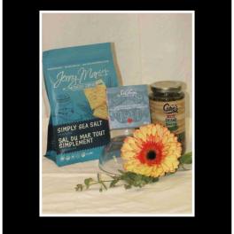 Gift basket with crackers, dip, beans, and a yellow gerbera daisy