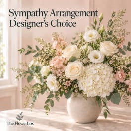 White and blush floral arrangement in a ceramic vase with text overlay