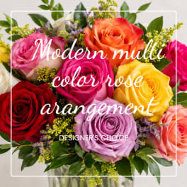 Multicolored rose bouquet with overlaid text in a clear vase