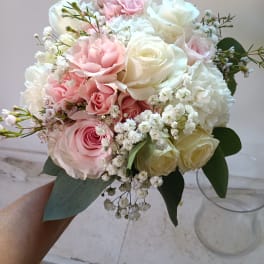 Bouquet of pink and white roses with baby's breath