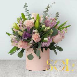 Pink roses and lilies in a blush cylindrical box