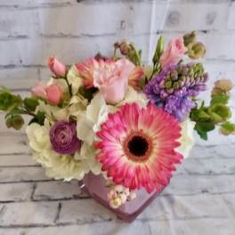 Pink and white mixed bouquet in a pink heart-shaped vase