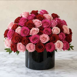 Bouquet of pink and red roses in a black vase