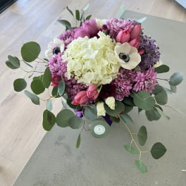 Pink and white mixed bouquet with eucalyptus on a table
