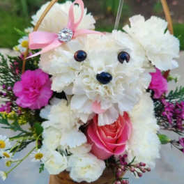 White floral teddy bear with a pink rose and ribbon bow