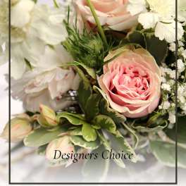 Pink roses and white flowers in a mixed bouquet