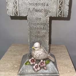 Decorative memorial cross with a bird and flowers
