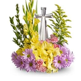 Yellow and purple floral arrangement with a silver ribbon centerpiece
