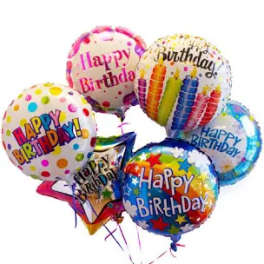 Cluster of colorful birthday balloons with printed messages