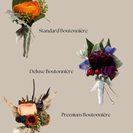 Three boutonnières with colorful flowers and ribbon wraps on a beige background