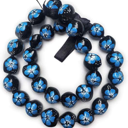 Black beaded necklace with blue flower patterns and a ribbon tie
