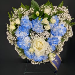 Blue and white floral wreath with roses and baby's breath