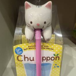 Cat-shaped plant watering spike in retail packaging