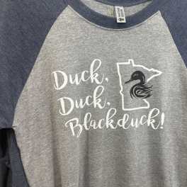 Gray and navy raglan T-shirt with a duck graphic and text