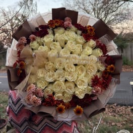 Large bouquet of cream roses with burgundy and pink mums