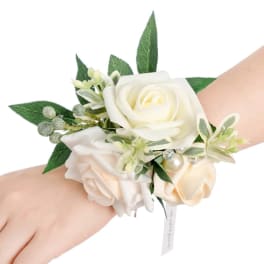 White and blush rose wrist corsage with green leaves and pearl accents