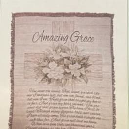 Framed wall hanging with the words "Amazing Grace" and floral artwork