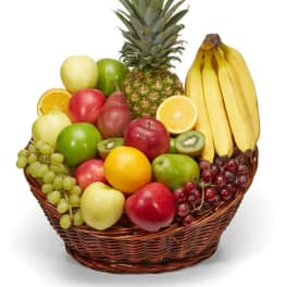Fruit basket with pineapple, bananas, apples, grapes, oranges, and kiwi