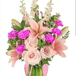 Pink lilies, roses, and carnations in a vase