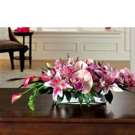 Low pink floral centerpiece in a rectangular container