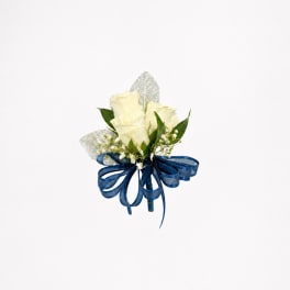 Small bouquet of white roses with a blue ribbon bow