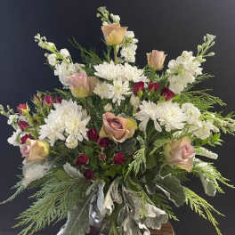 Bouquet of white chrysanthemums and blush roses with greenery