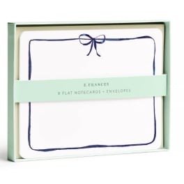 Boxed set of flat notecards and envelopes with a navy bow design