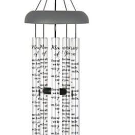 Hanging metal wind chime with silver tubes and a dark clapper