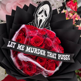 Red rose bouquet with a horror mask topper and a text banner